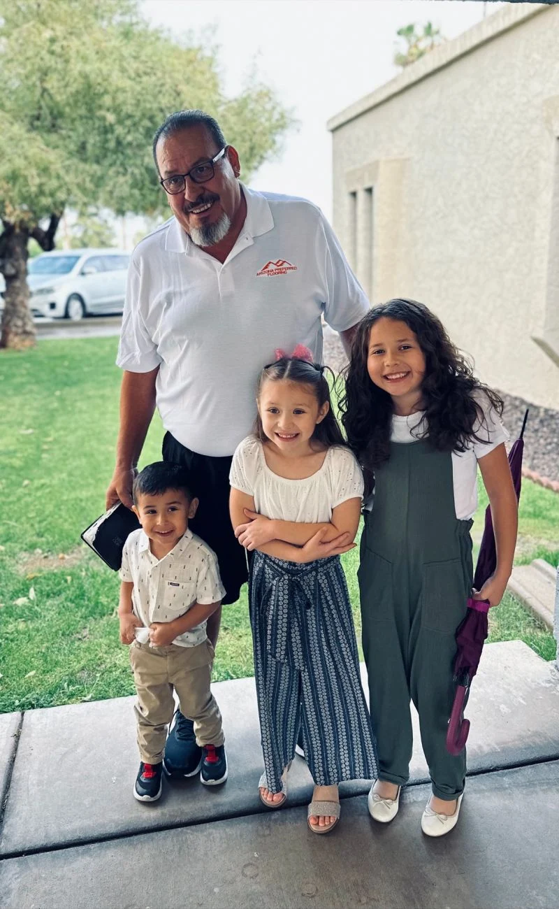 One of Arizona Preferred Flooring’s owners with his family
